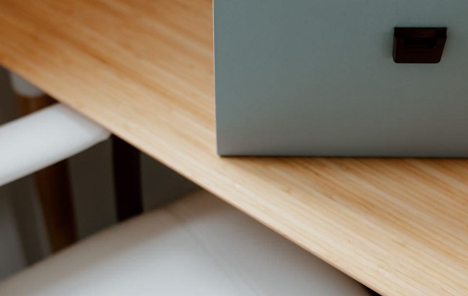 Two documents laid side by side for comparison on a desk